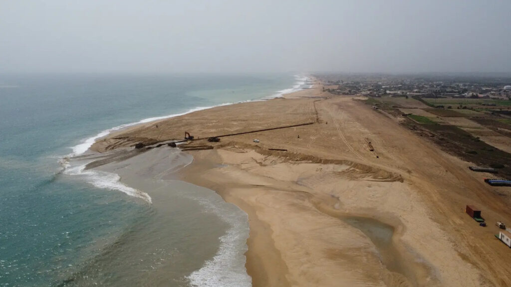 An aerial shot shows the shape of a ‘sand motor’ project in Benin. The project was built by the dredging firm Boskalis with funding from the World Bank. (Courtesy of Boskalis)