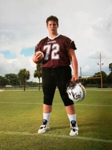 Zachary Martin poses for a photo in high school football uniform. (Courtesy of the Zach Martin Memorial Foundation)