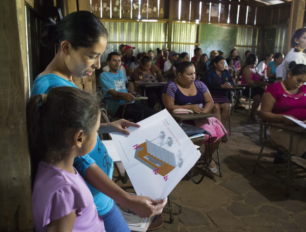 A government teacher shows a new school design to students. The school was funded by VoLo Foundation and has served nearly 2,000 students. It has been a place for health and community workshops, and even served as a shelter during severe storms. (Submitted photo)