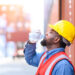 A worker takes a water break in the heat (iStock image)