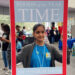 Deerfield Beach High School student, Khushi Desai, held up a Time Person of the Year cover, in honor of climate activist and 2019 person of the year, Greta Thunberg. (Caitie Switalski/WLRN)