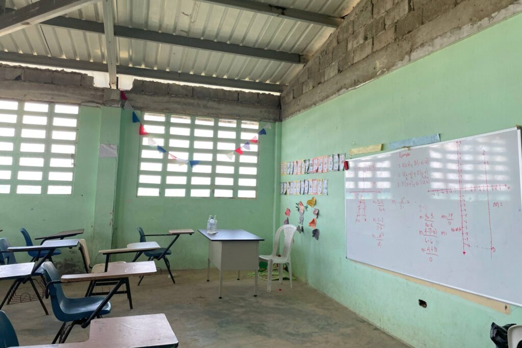 Part of thise school building is falling into the water due to erosion of the building materials and school supplies often become damaged due to flooding. _Image courtesy of Human Rights Watch)
