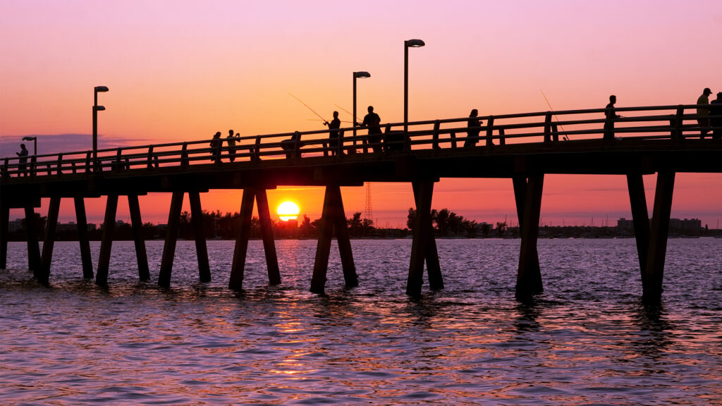 Anglers fish off a pier in Sarasota (iStock image)