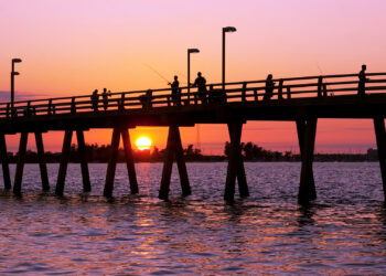 Anglers fish off a pier in Sarasota (iStock image)