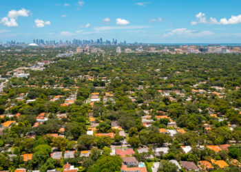An aerial shot of Coral Gables with the downtown Miami skyline in the background (iStock image)
