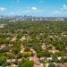 An aerial shot of Coral Gables with the downtown Miami skyline in the background (iStock image)