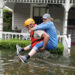 A National Guardsman giving a woman a piggyback in waist-deep floodwaters outside a house as part of rescue operations in flooded areas around Houston in 2017. (Zachary West/National Guard, CC BY 2.0, via Wikimedia Commons)