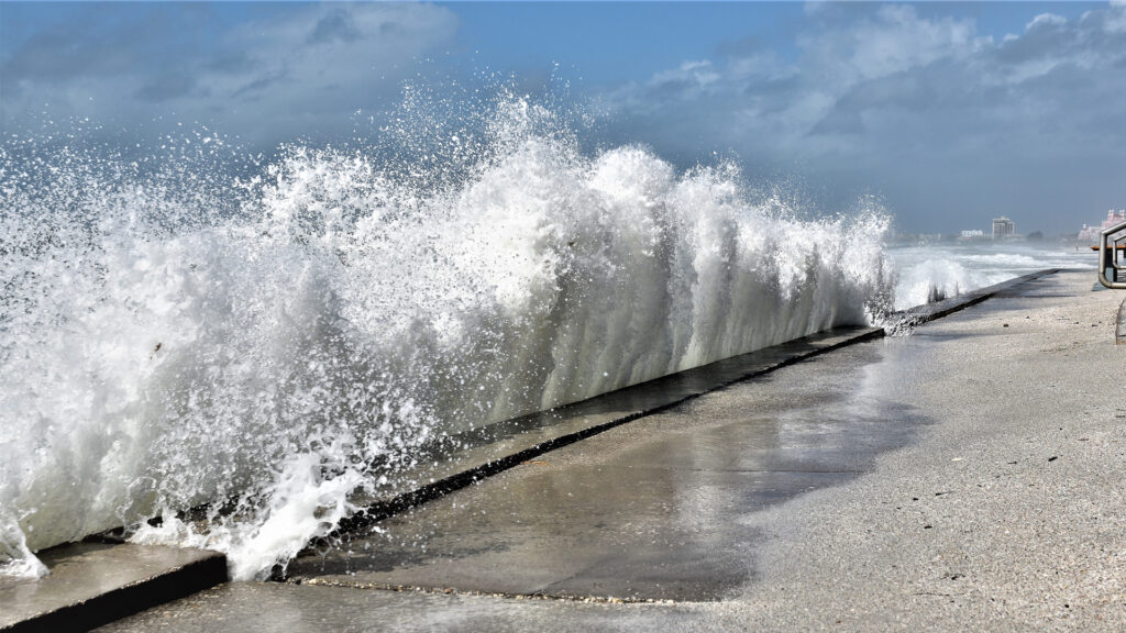 A wave crashes against a seawall in St. Pete Beach. (iStock image)
