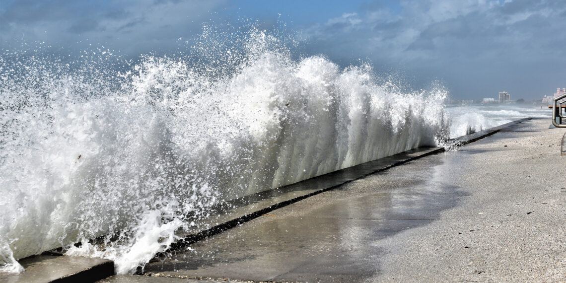 A wave crashes against a seawall in St. Pete Beach. (iStock image)