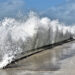 A wave crashes against a seawall in St. Pete Beach. (iStock image)