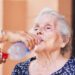 An elderly woman is given water (iStock image)