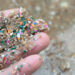 Plastic particles in the sand at a beach (iStock image)