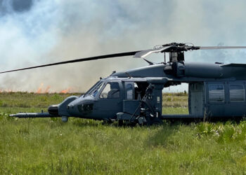 An HH-60 Pave Hawk helicopter at Avon Park Air Force Range with a prescribed fire in the background. The range’s habitats benefit from being able to have prescribed burns, an important tool for maintaining the health of natural landscapes in Florida. (Image courtesy of Avon Air Force Range)