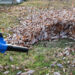 An electric leaf blower is used on a yard (iStock image)
