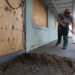 Matt Suggs shovels mud outside the old Nature Coast Biological Station lab following Hurricane Idalia. (Tyler Jones, UF/IFAS)
