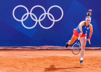 Czech tennis player Karolína Muchová hits a serve at the 2024 Paris Olympics. (Kuberzog, CC BY-SA 4.0, via Wikimedia Commons)