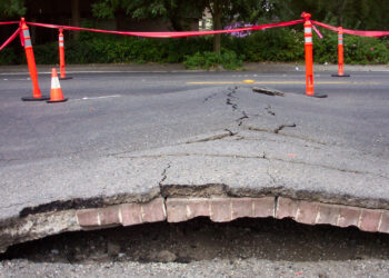 A "heat bump" or "blow-up" is a buckling upward of pavement caused by thermal expansion. (Seattle Department of Transportation, CC BY-NC 2.0, via Flickr)