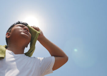A man shields himself from the sun (iStock image)