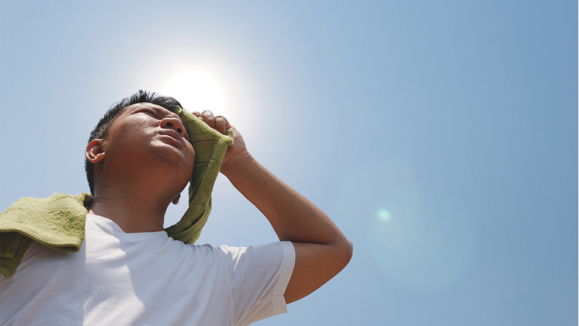 A man shields himself from the sun (iStock image)