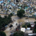 Haitian citizens walk through the flooded streets of Port-au-Prince in 2020 after Hurricane Tomas hit the country. (DVIDSHUB, CC BY 2.0, via Wikimedia Commons)