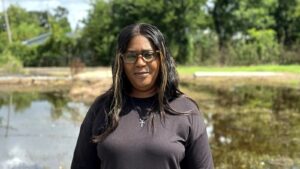 Tasha Guidry stands in front of what used to be a family-owned supermarket in north Lake Charles. (Zoya Teirstein/Grist)