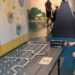 A visitor engages with an interactive exhibit at the Museum of Discovery and Science, exploring the mechanics behind energy generation and sustainable technology. (Photo courtesy of MODS)