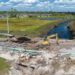 A road and bridge damaged by flooding are reconstructed in Florida (iStock image)