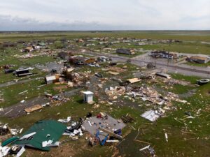An aerial view shows damage to a neighborhood by Hurricane Laura outside of Lake Charles, Louisiana in 2020. (AFP/Getty Images via Grist)