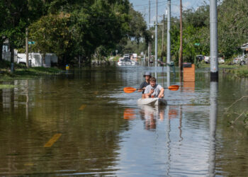 A Tampa street still flooded four days after Hurricane Milton. (Liz Roll/FEMA, via Defense Visual Information Distribution Service)