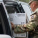 Florida Army National Guard Staff Sgt. Martin Martinez distributes food in Bradenton to assist the local community Oct. 11 following Hurricane Milton. (U.S. Army photo by Sgt. Marc Morgenstern, via Defense Visual Information Distribution Service)