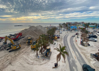 Crews clean up sand scattered throughout Fort Myers Beach during Hurricane Ian and use the sand to build back the beach. (Jocelyn Augustino/FEMA via Defense Visual Information Distribution Service)