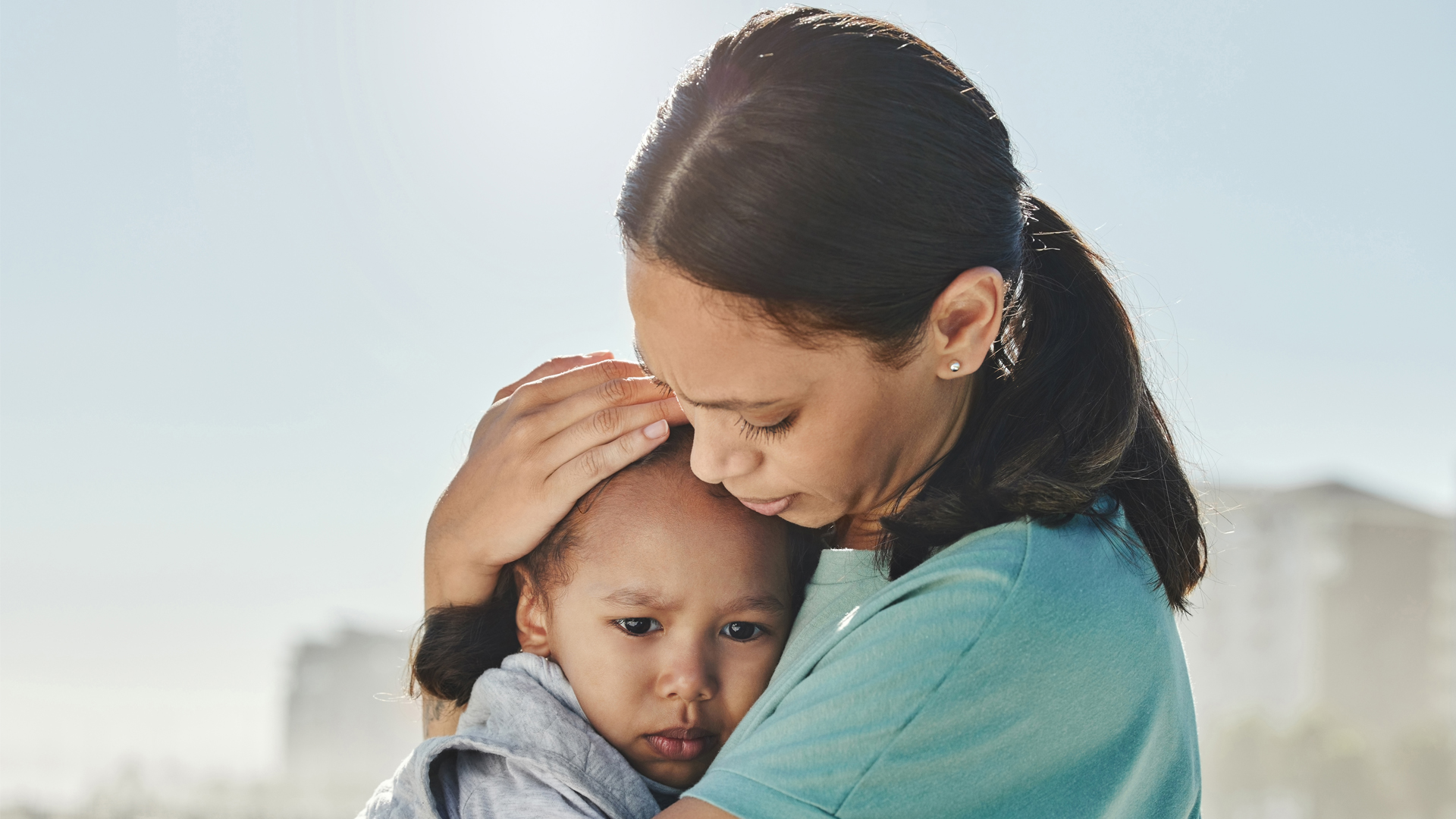 A mother comforts her child (iStock image)