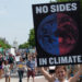 A demonstrator holds a sign at the 2017 D.C. Climate March (Mark Dixon, CC BY 2.0, via flickr)