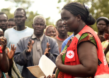 In 2015, the Uganda Red Cross used early storm forecasts to send workers to distribute thousands of water purification tablets, water storage containers and other items to people in rural areas likely to be flooded by the storm. (Denis Onyodi/URCS-Climate Centre, CC BY-NC)