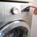 A washing machine is adjusted (iStock image)
