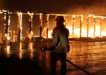 A firefighter at the Palisades Fire in Southern California on Jan. 8 (CAL FIRE, Public domain, via Wikimedia Commons)