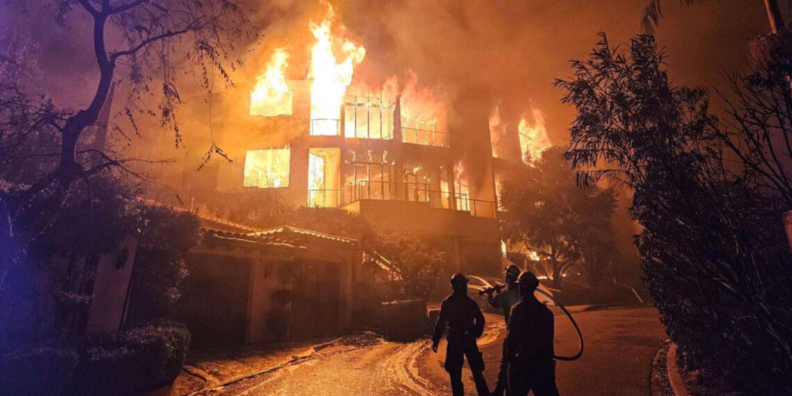 Firefighters with a Forest Service task force battle the Palisades Fire in Southern California on Jan. 13, 2025. (USDA Pacific Southwest Forest Service, public domain, via Wikimedia Commons)