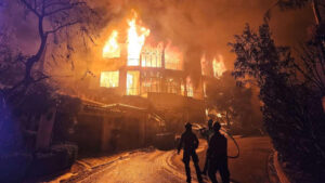 Firefighters with a Forest Service task force battle the Palisades Fire in Southern California on Jan. 13, 2025. (USDA Pacific Southwest Forest Service, public domain, via Wikimedia Commons)