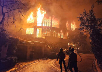 Firefighters with a Forest Service task force battle the Palisades Fire in Southern California on Jan. 13, 2025. (USDA Pacific Southwest Forest Service, public domain, via Wikimedia Commons)