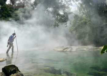 University of Miami graduate student Riley Fortier treks through the boiling river region of the Amazon rainforest in Peru. (Photo courtesy of Riley Fortier)