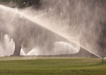 Sprinklers pour water on a golf course fairway in Florida (iStock image)