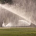 Sprinklers pour water on a golf course fairway in Florida (iStock image)