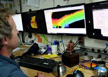 A hydrographer converts sonar data into imagery for NOAA (NOAA's National Ocean Service)