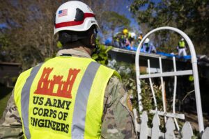 The U.S. Army Corps of Engineers assist a family of survivors in their first Blue Roof Project in Sarasota in the aftermath of Hurricane Milton. (Photo by Carlos M. Vazquez II/FEMA, via Defense Visual Information Distribution Service)
