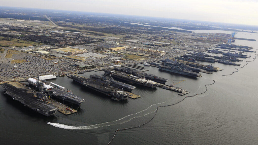 A view of aircraft carriers docked at the sprawling Naval Station Norfolk show how much of the region is within a few feet of sea level. (Mass Communication Specialist 2nd Class Ernest R. Scott, Public domain, via Wikimedia Commons)