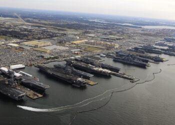 A view of aircraft carriers docked at the sprawling Naval Station Norfolk show how much of the region is within a few feet of sea level. (Mass Communication Specialist 2nd Class Ernest R. Scott, Public domain, via Wikimedia Commons)