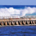 Waves crash against a seawall in South Florida (iStock image)