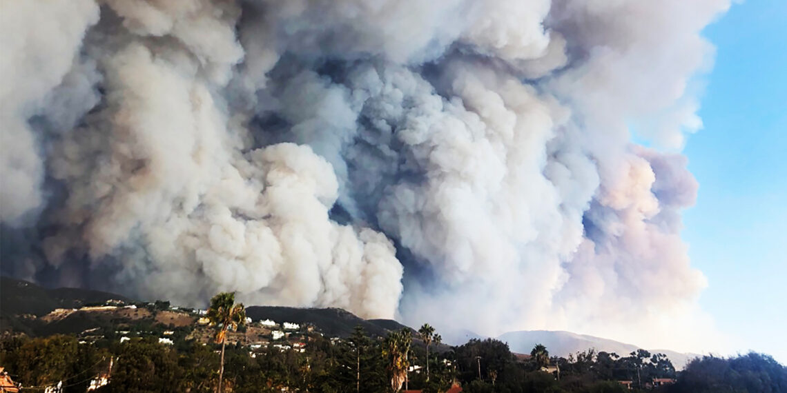 Florida State University researchers will use new funding from the National Science Foundation to investigate mechanisms that drive wildfire spread including how smoke plumes, like these seen over a fire in California, behave and interact with atmospheric stratification and topography. (iStock image)