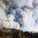 Florida State University researchers will use new funding from the National Science Foundation to investigate mechanisms that drive wildfire spread including how smoke plumes, like these seen over a fire in California, behave and interact with atmospheric stratification and topography. (iStock image)