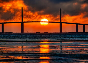 The sun sets behind the Sunshine Skyway bridge over Tampa Bay. (iStock image)